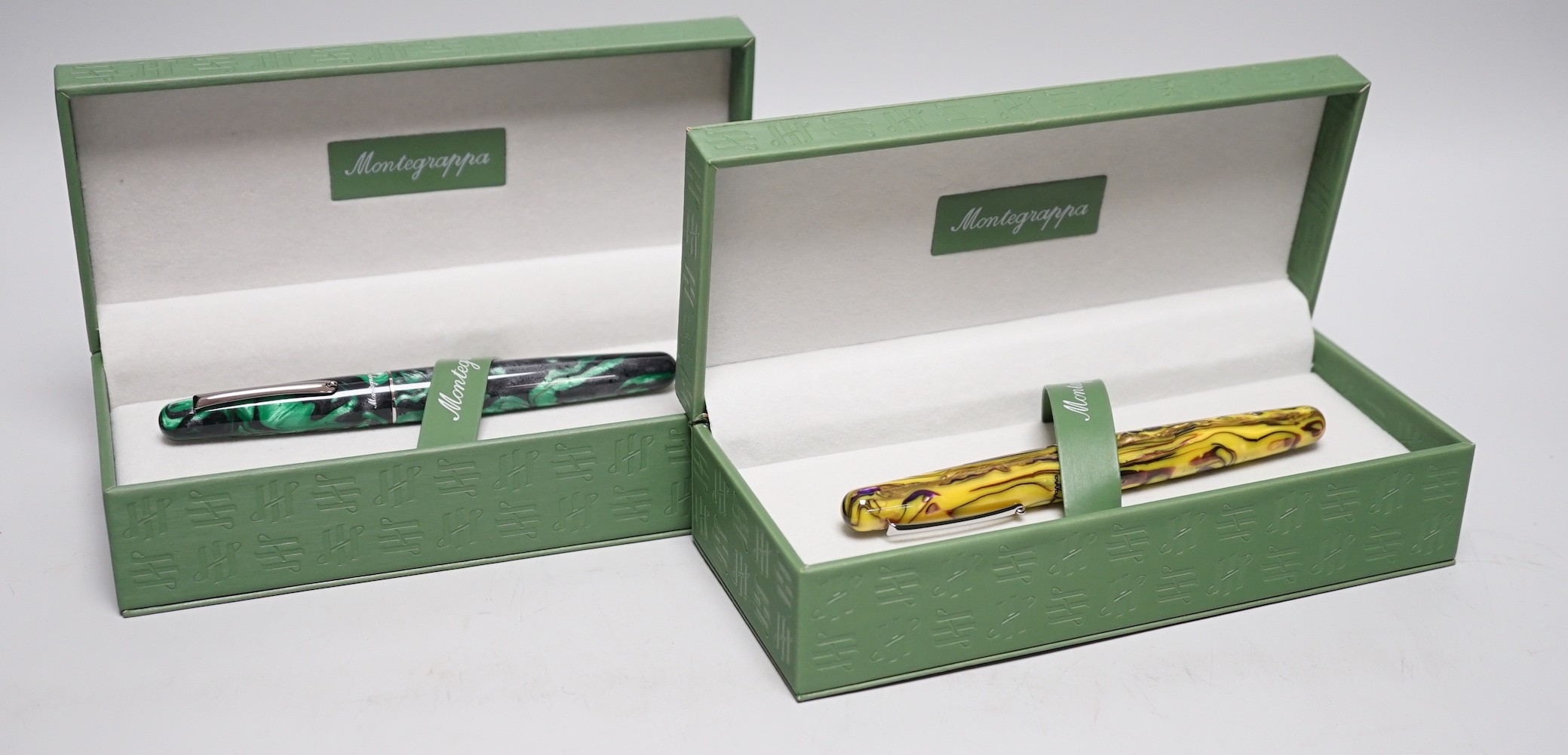 Two Montegrappa fountain pens; Elmo 01 Black Star Calla Lily and Elmo 01 Iris Yellow, cased